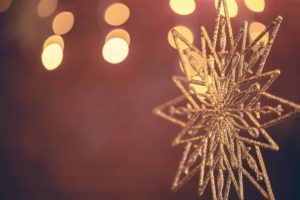 Christmas background with decorative star with bokeh lights.